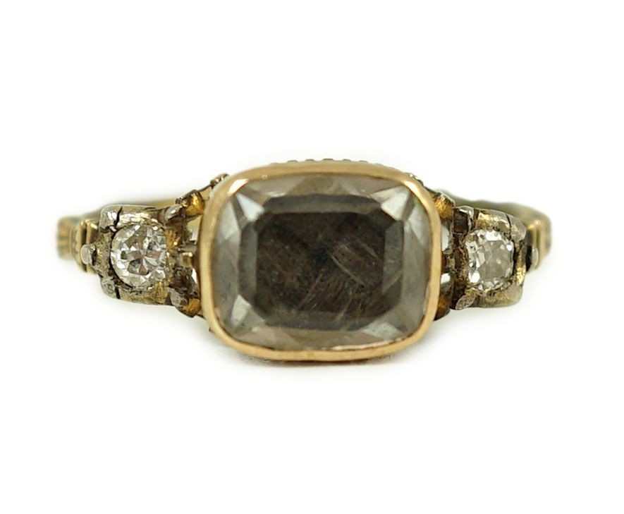 An 18th century gold and rock crystal and diamond set mourning ring